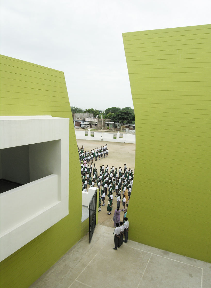 NUDES builds high school as monolithic mass 'punctuated' by voids in india