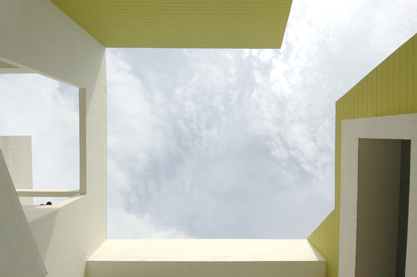 NUDES builds high school as monolithic mass 'punctuated' by voids in india