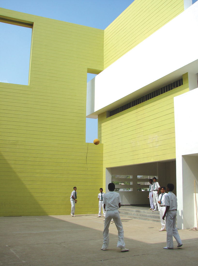 NUDES builds high school as monolithic mass 'punctuated' by voids in india