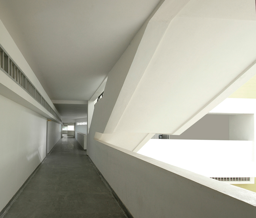 NUDES builds high school as monolithic mass 'punctuated' by voids in india