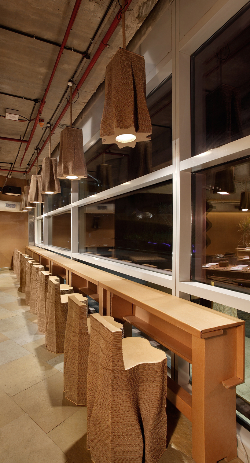 this mumbai cafe by NUDES is made almost entirely from cardboard designboom