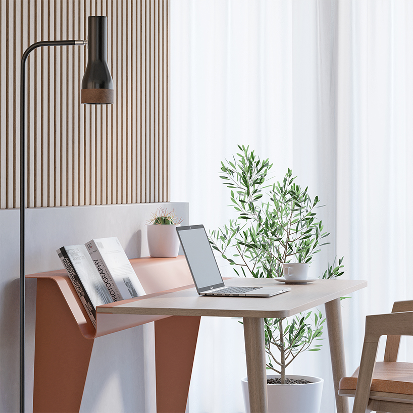 the piano desk features a metal stand that holds books like sheets of music designboom