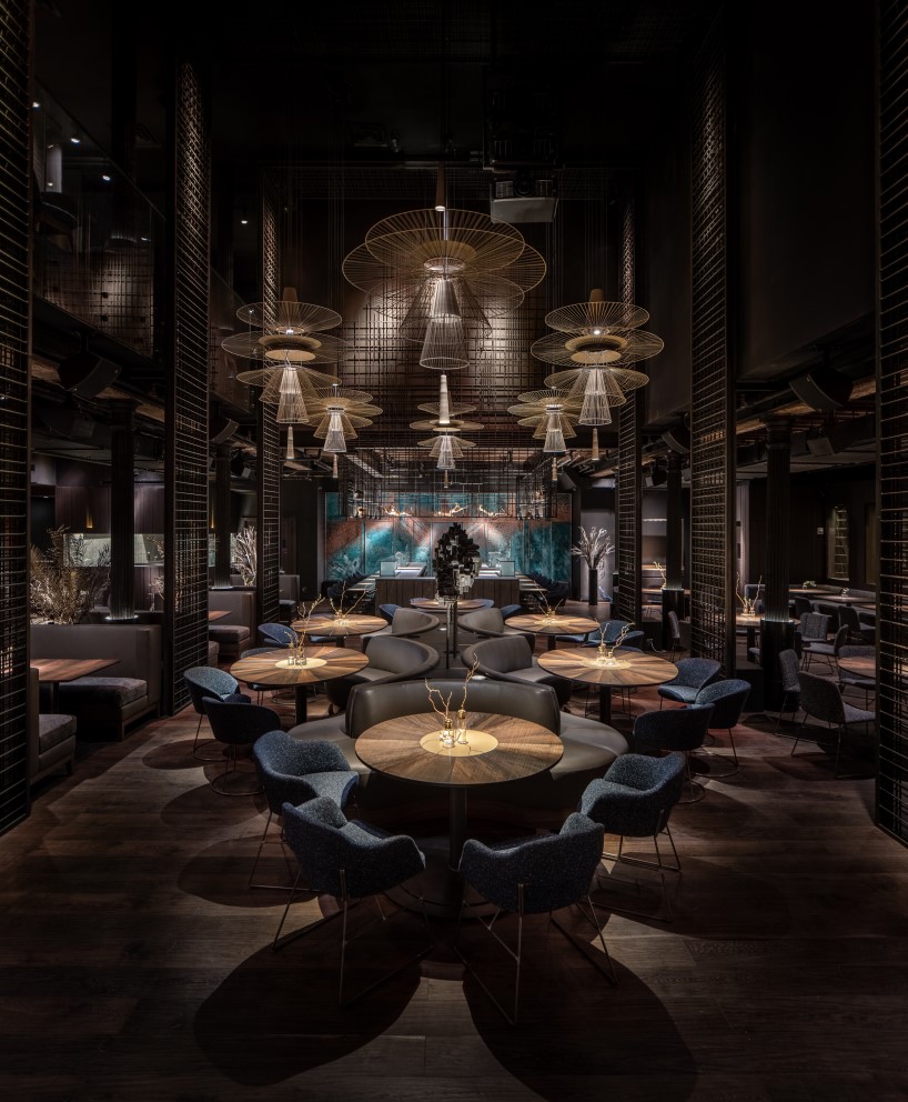 4.5-meter-tall glass-hewn buddha sculpture decorates restaurant interior in new york
