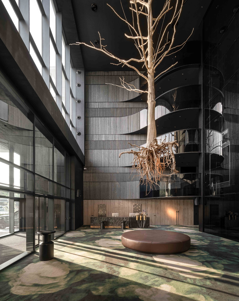 YOD group suspends sycamore tree installation to illuminate grand hotel atrium in ukraine