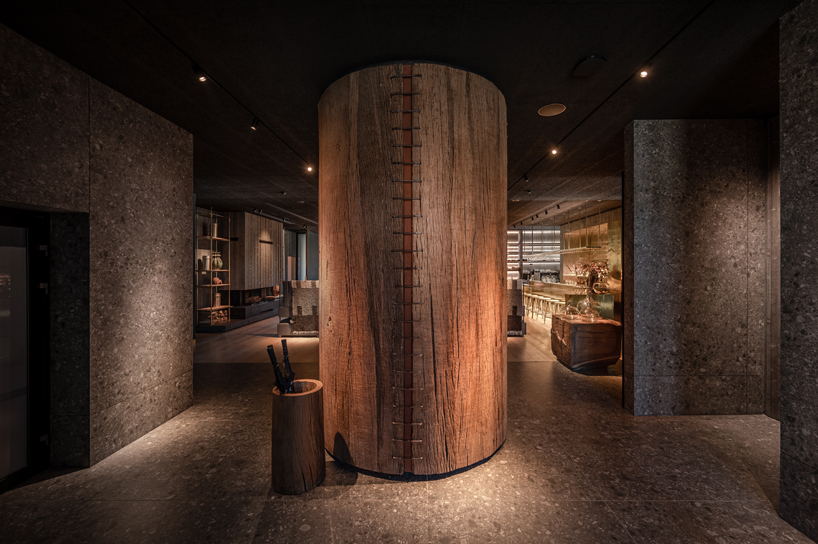yod group embeds portholes looking into steel pool within hay boutique hotel's corridors