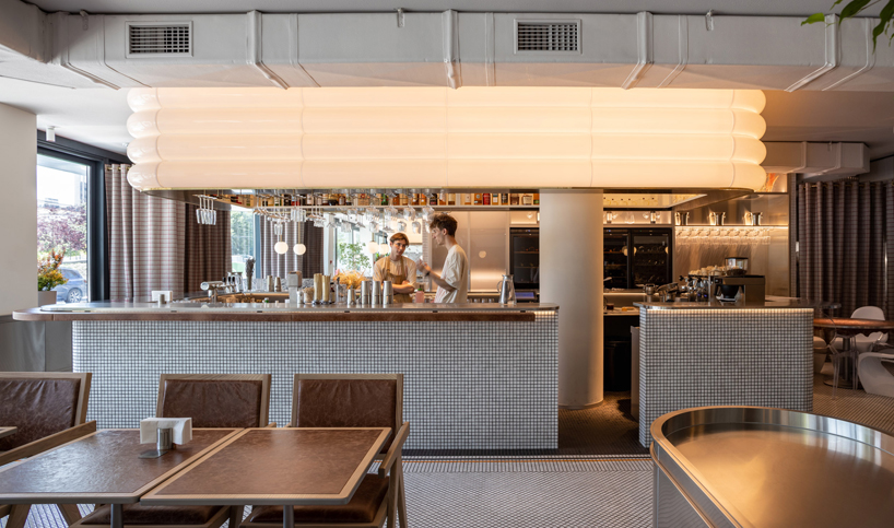 mosaics, check patterns, and textured veneers clad YOD group's modern italy-inspired bistro