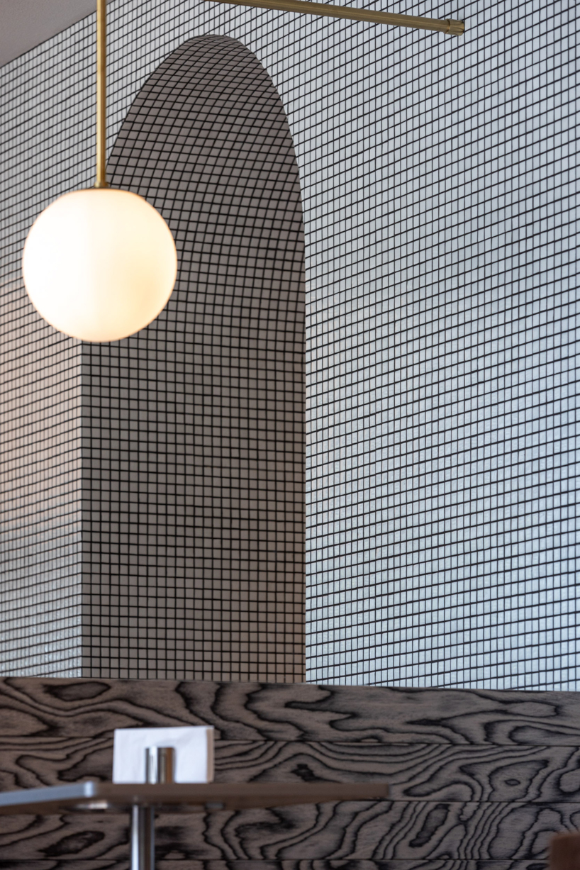 mosaic tiles, check patterns, and textured veneers clad YOD group's bistro in ukraine