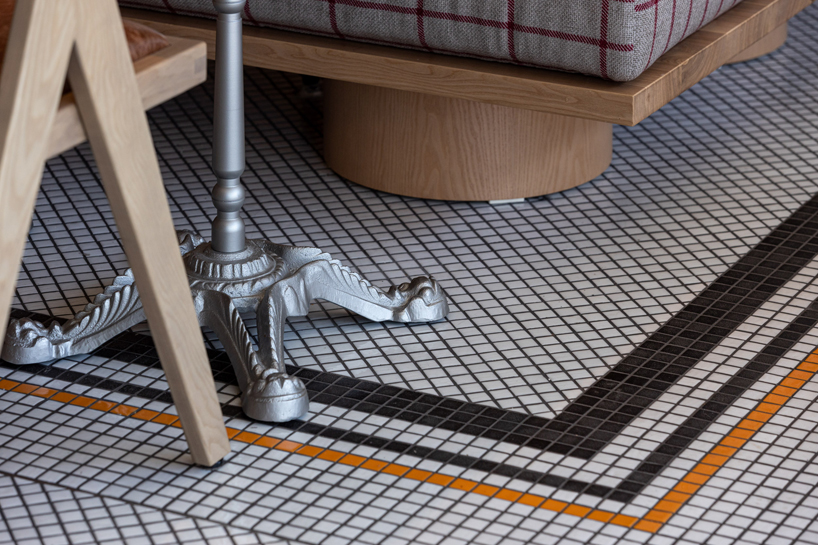 mosaic tiles, check patterns, and textured veneers clad YOD group's bistro in ukraine