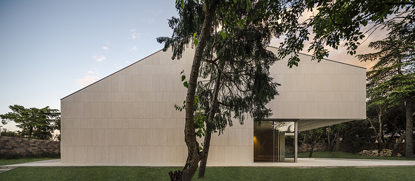 zooco estudio articulates casa M4 with three limestone volumes in madrid