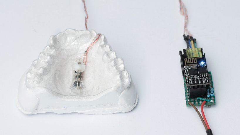 [in]brace is a wearable device that uses tongue movement to interact with computers designboom