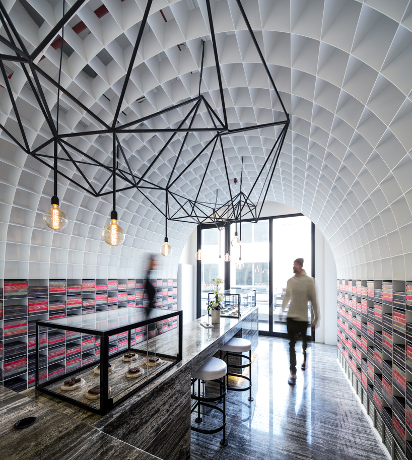 studio toggle encloses chocolate boutique within a cellular steel vault