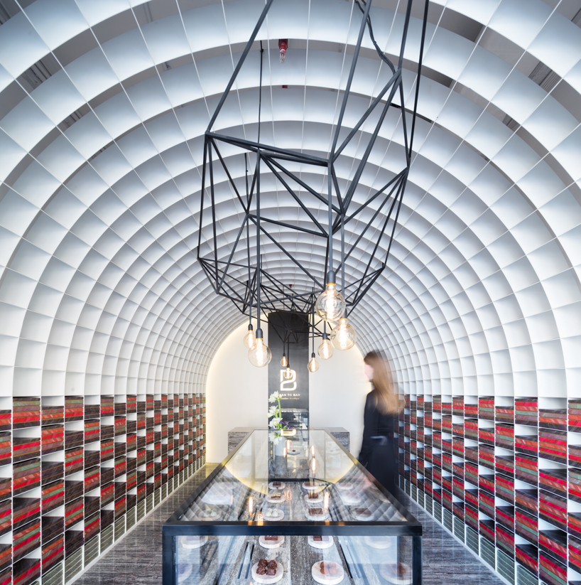 studio toggle encloses chocolate boutique within a cellular steel vault