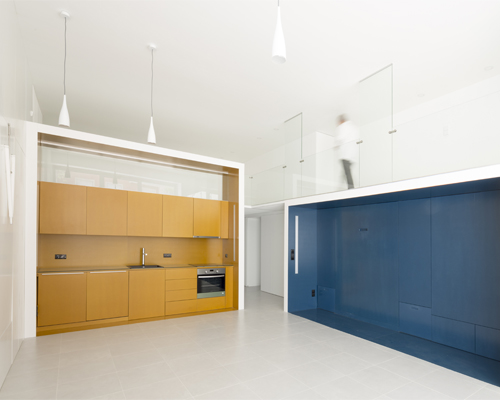 waataa converts commercial studio into colorful space-saving rooms