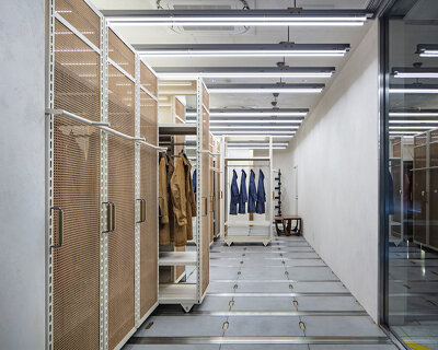 movable display racks allow multiple configurations in this apparel showroom in tokyo