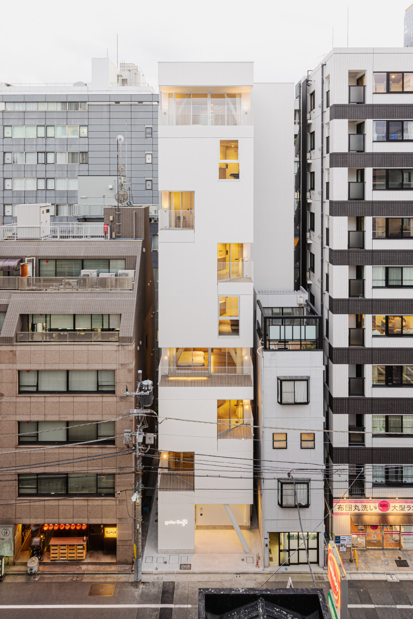 kooo architects carves luminous terraces into hotel facade on narrow, downtown tokyo lot