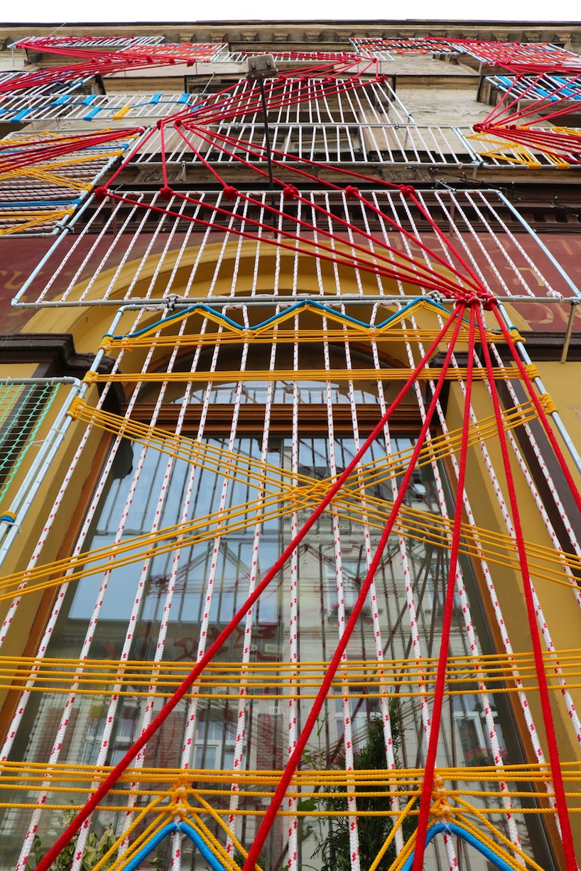 entropika intertwines past and present with woven façade in łódź, poland