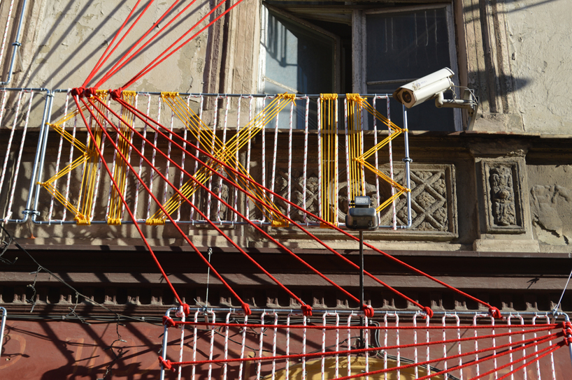 entropika intertwines past and present with woven façade in łódź, poland