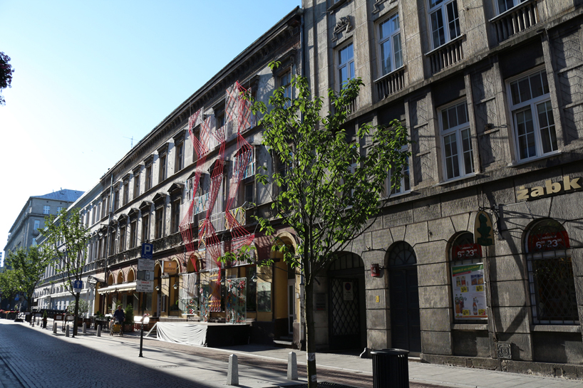 entropika intertwines past and present with woven façade in łódź, poland