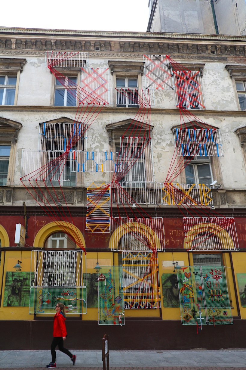 entropika intertwines past and present with woven façade in łódź, poland