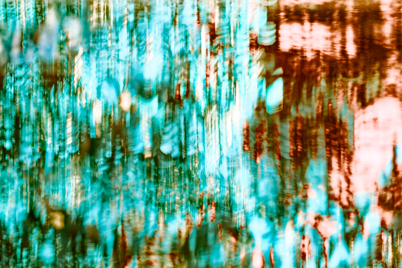 coral-toned timber and mirror canopy by GRRIZ transforms footbridge above river in france