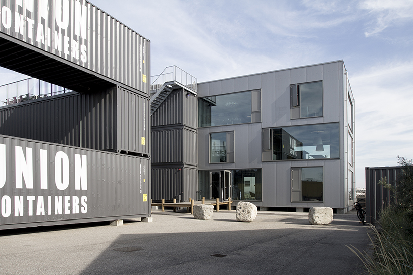 arcgency uses stacked shipping containers to offer sustainable + affordable office space - 1