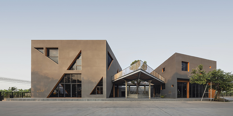 triangular skylights pierce café's concrete volumes by ASWA in thailand