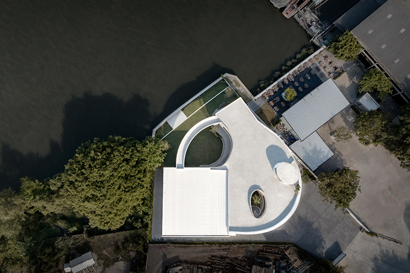 ASWA's riverside wedding venue shapes continuous curves into ring formation in bangkok