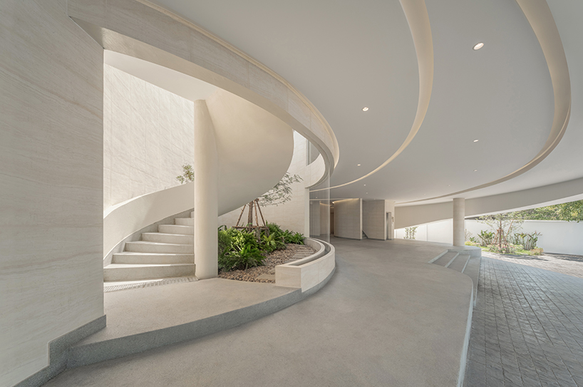 ASWA's riverside wedding venue shapes continuous curves into ring formation in bangkok