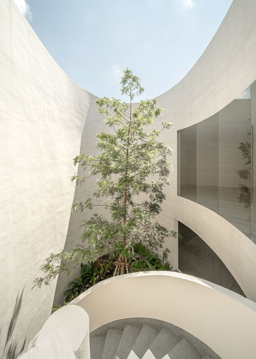 ASWA's riverside wedding venue shapes continuous curves into ring formation in bangkok