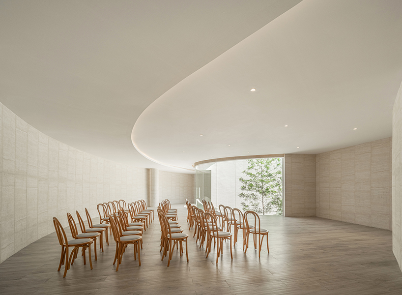 ASWA's riverside wedding venue shapes continuous curves into ring formation in bangkok