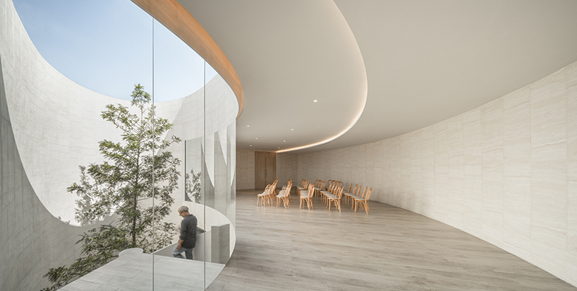 ASWA's riverside wedding venue shapes continuous curves into ring formation in bangkok