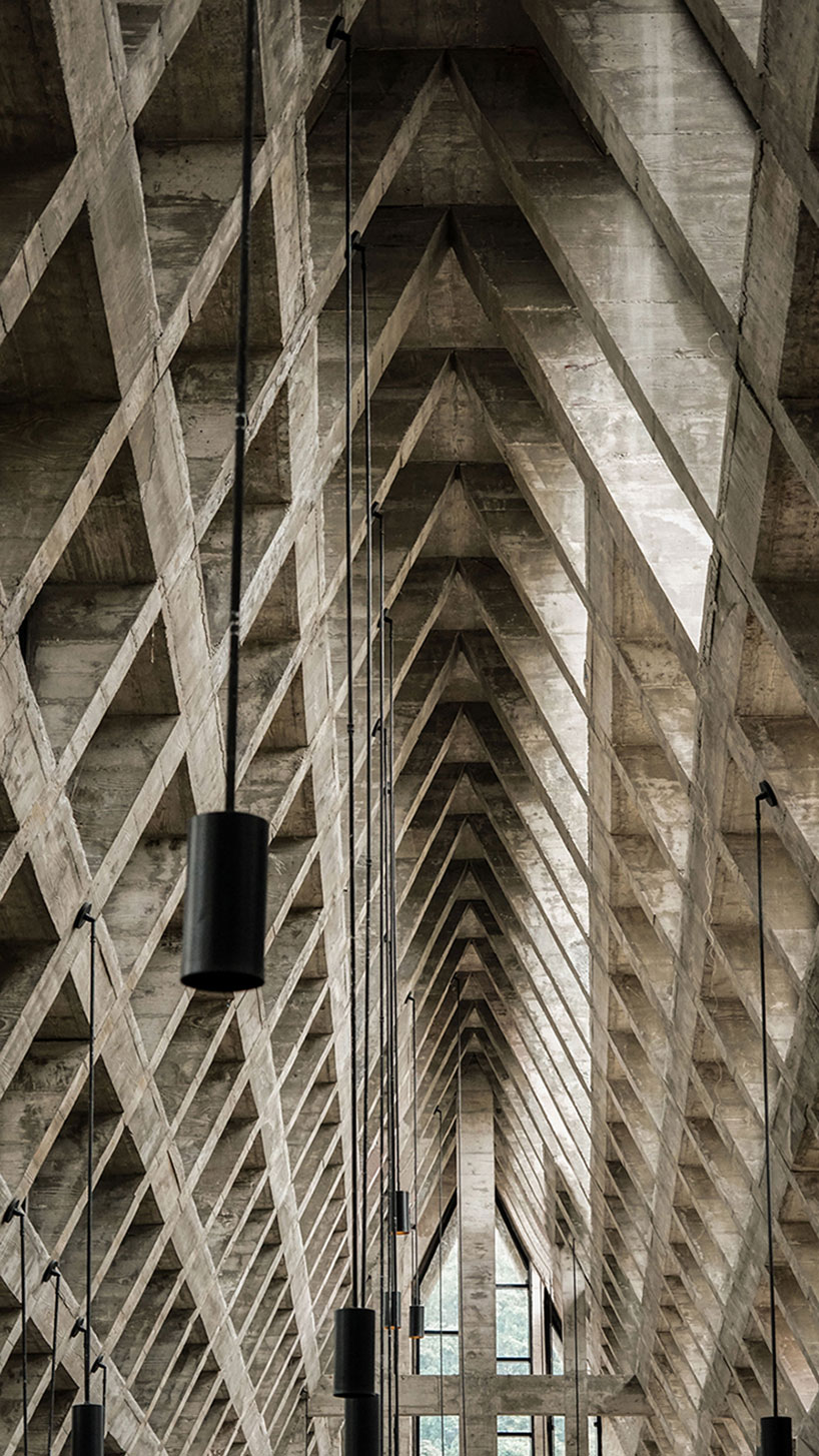 west-line studio's triangular-shaped cultural center in china pays homage to shui people