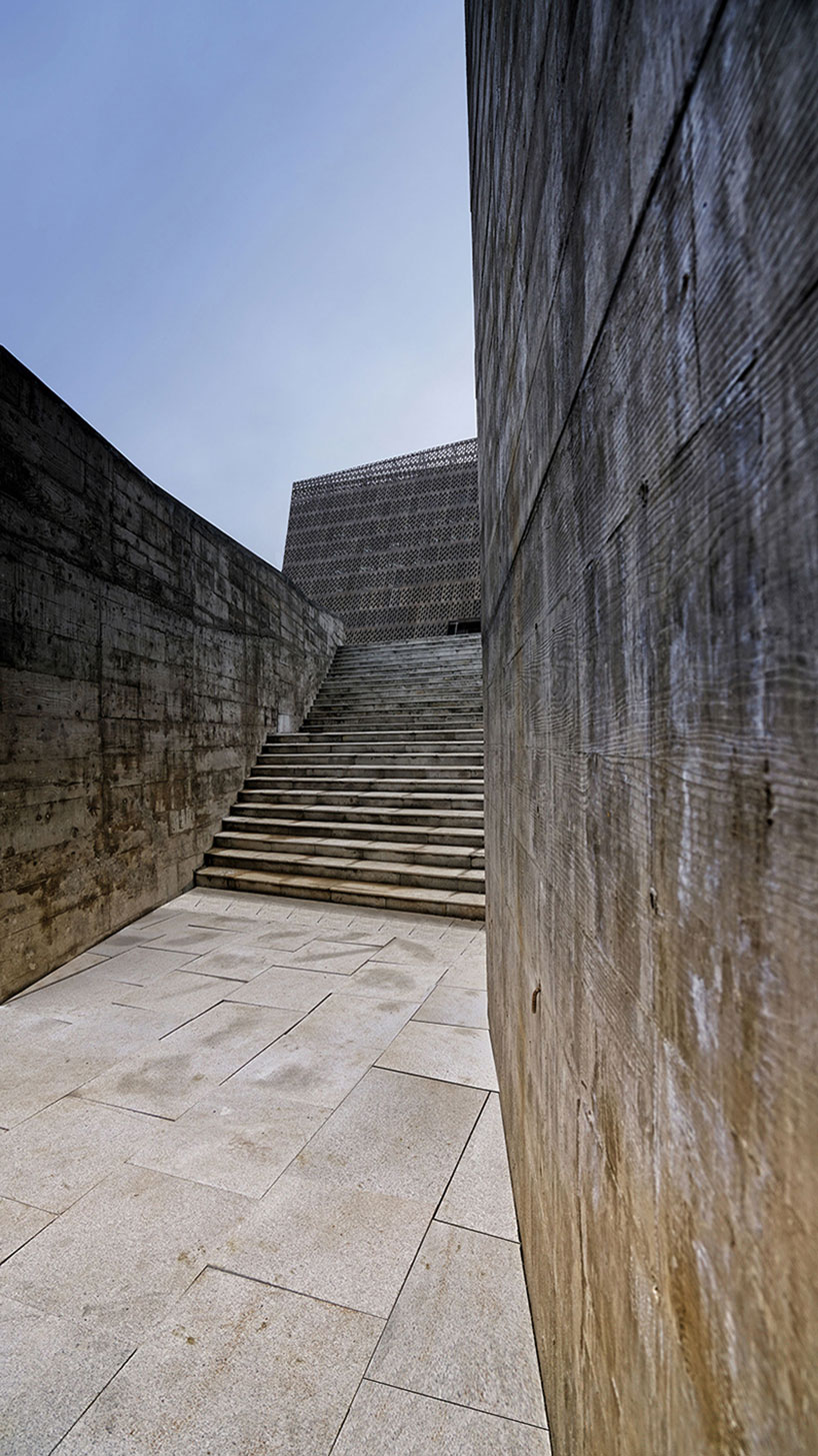 west-line studio's triangular-shaped cultural center in china pays homage to shui people