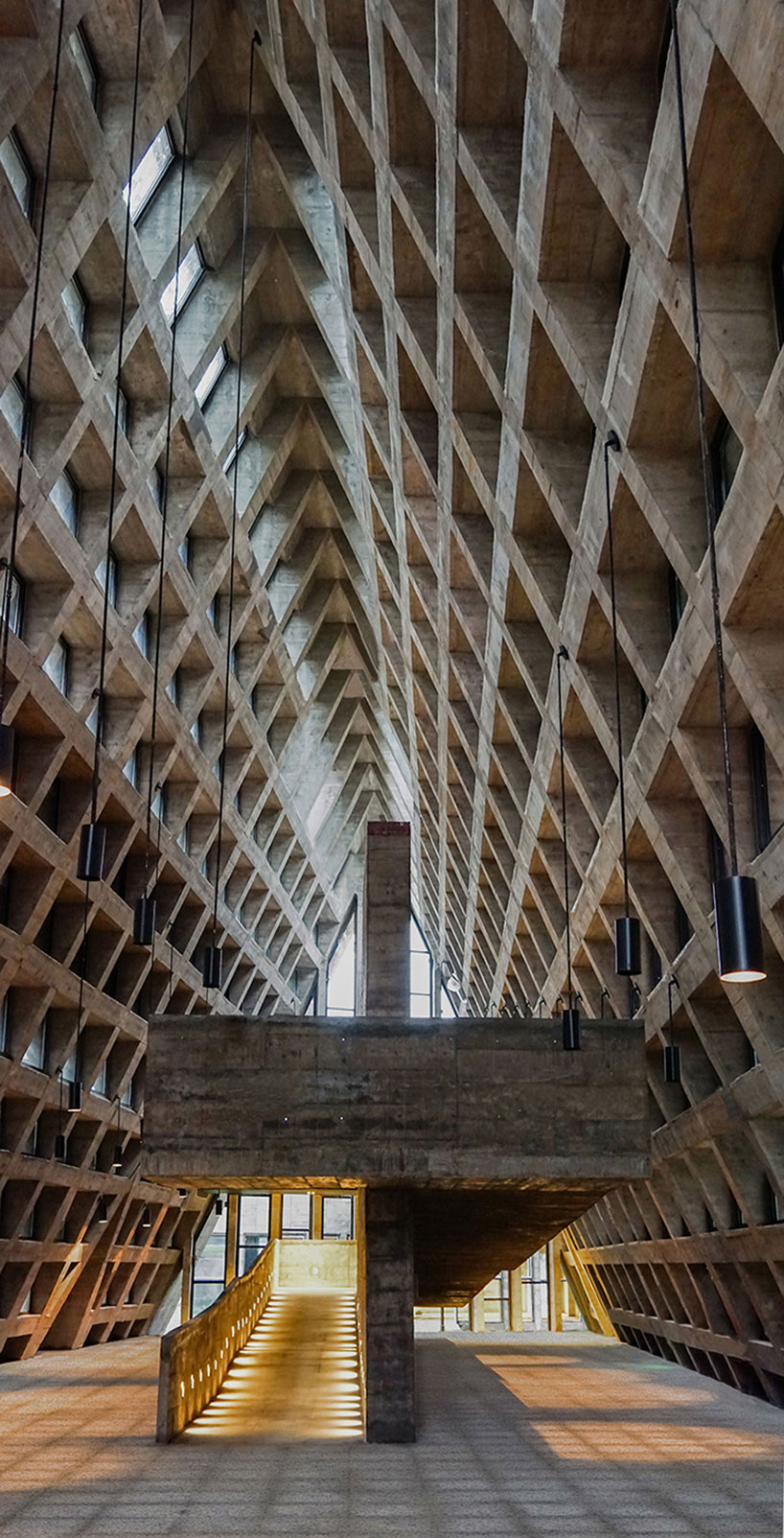 west-line studio's triangular-shaped cultural center in china pays homage to shui people