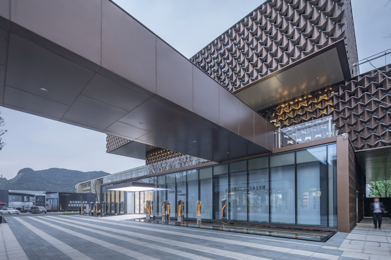 NAN architects covers a sales center with a geometrical pattern designboom