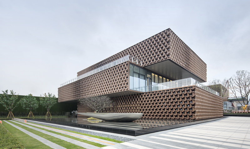 NAN architects covers a sales center with a geometrical pattern designboom