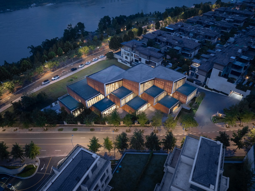 permeable terracotta brick screens wrap kindergarten's stacked volumes by NAN architects