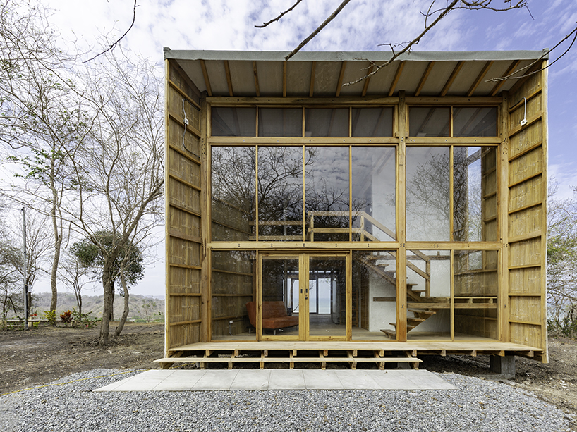 emilio lópez uses local wood to create double height spaces for house in ecuador