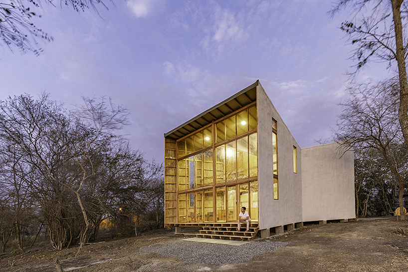 emilio lópez uses local wood to create double height spaces for house in ecuador