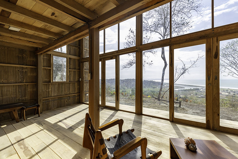 emilio lópez uses local wood to create double height spaces for house in ecuador