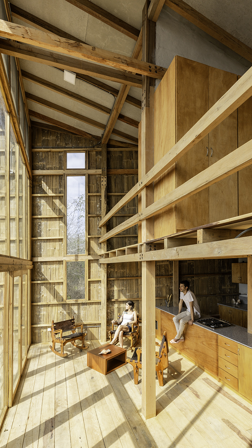 emilio lópez uses local wood to create double height spaces for house in ecuador