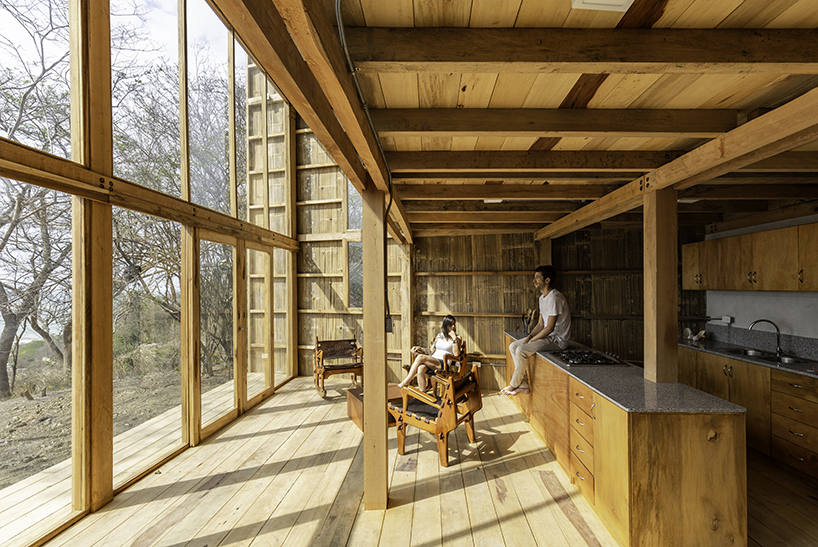 emilio lópez uses local wood to create double height spaces for house in ecuador