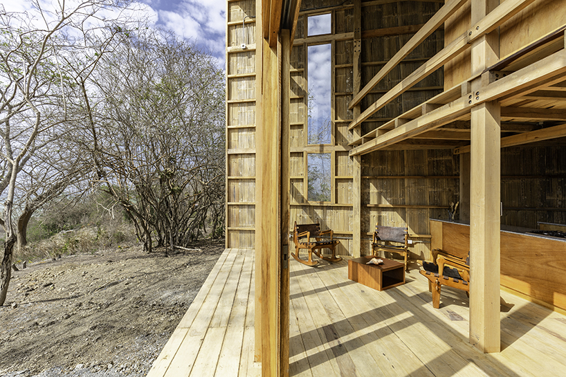 emilio lópez uses local wood to create double height spaces for house in ecuador