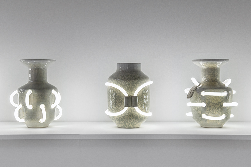 néophore series by döppel studio embeds neon lights into ceramic amphorae