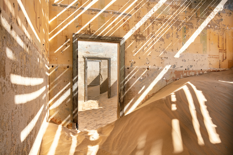 james kerwin captures towns buried in sand for 'uninhabited' photo series designboom