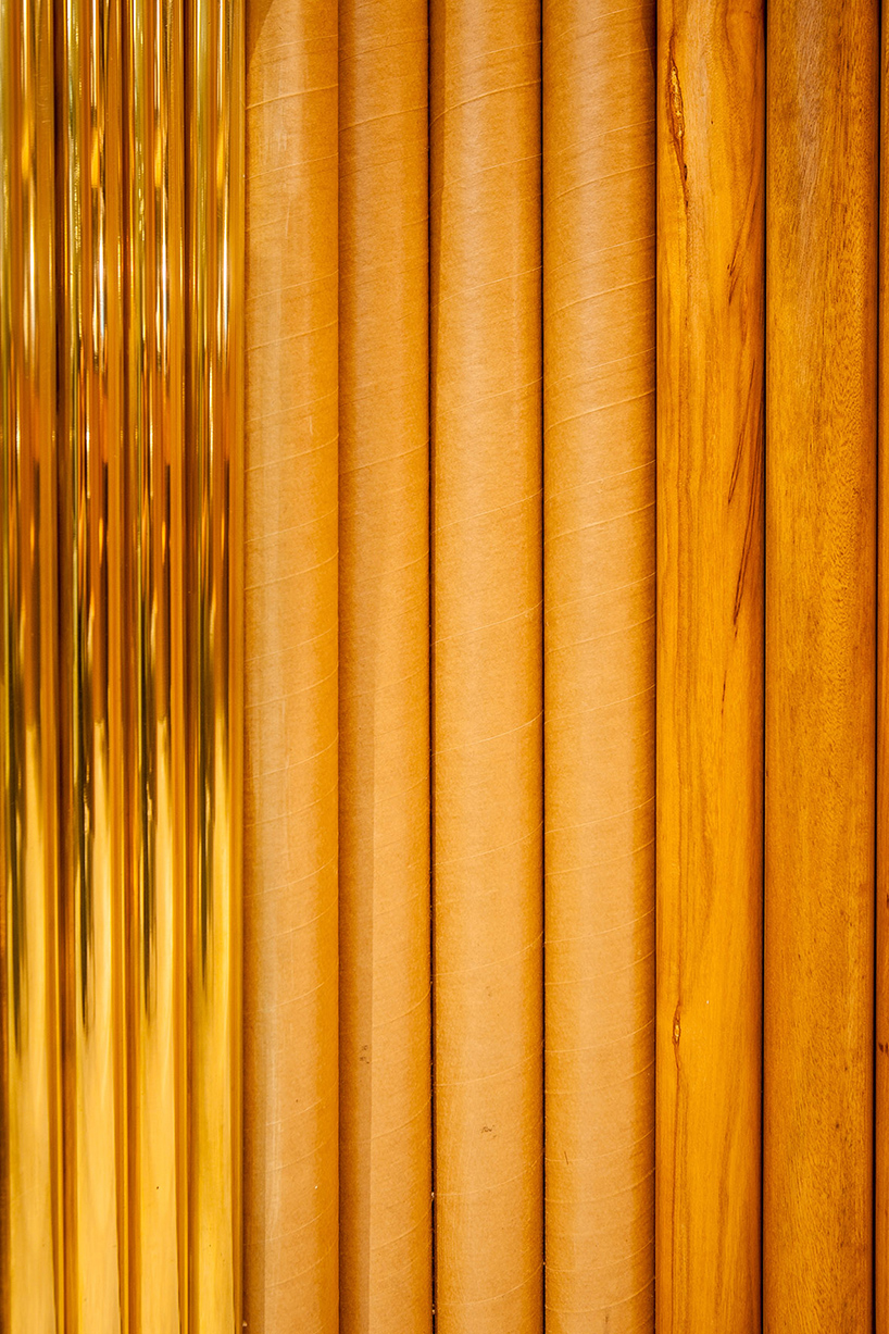 estúdio chão wraps são paulo jewelry store in wood, brass + cardboard