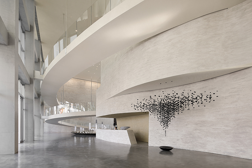 waterfrom design forms sweeping organic curves for art space in china