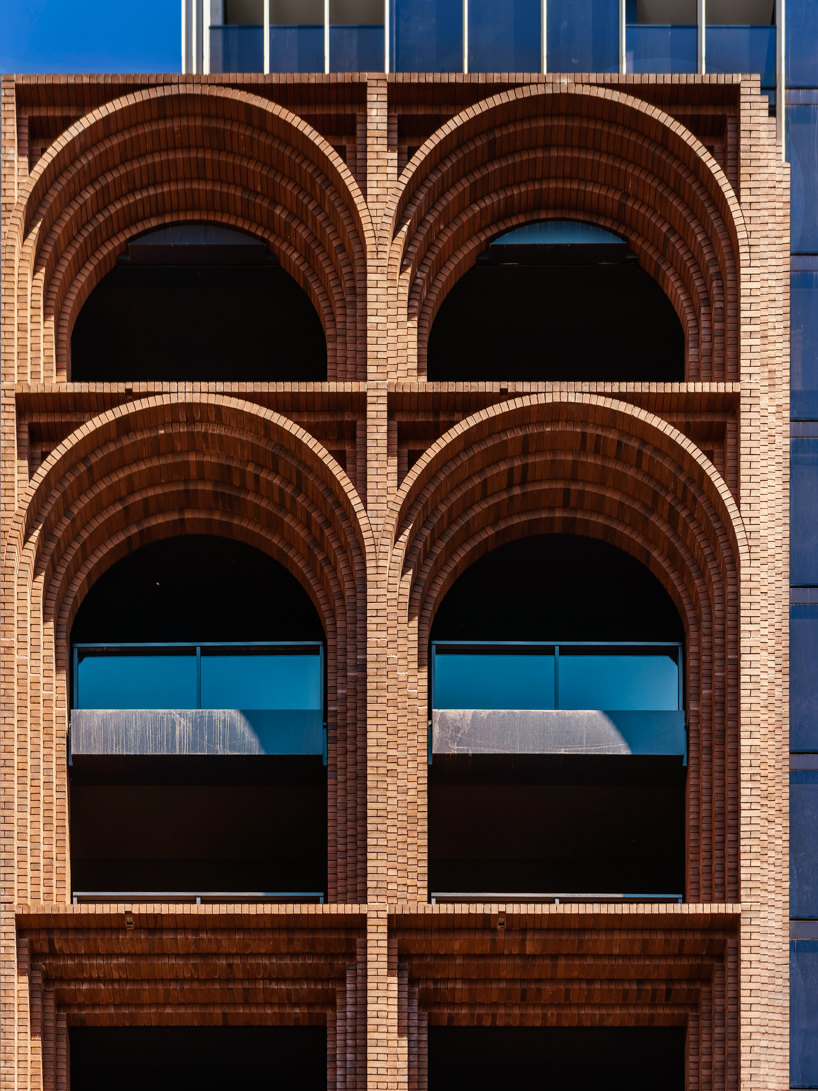 koichi takada architects uses over 300,000 bricks to create 'arc' façade in sydney