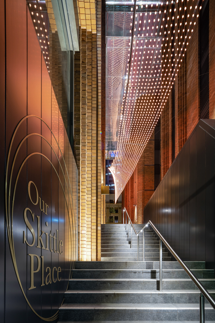 koichi takada architects uses over 300,000 bricks to create 'arc' façade in sydney