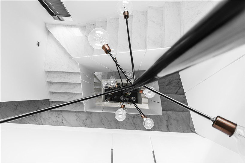 wei yi design creates a family home of monochrome + marble in nanjing, china